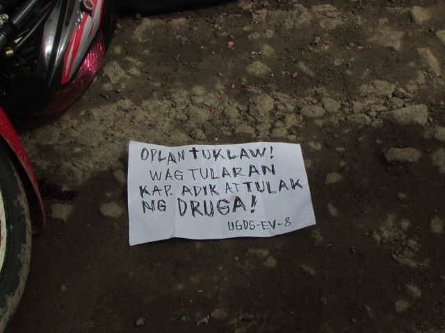 VILLAGE CHIEF, AIDE; SHOT TO DEATH